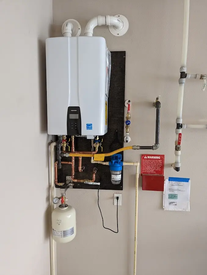 Professional plumber installing copper piping in a Rockmart home